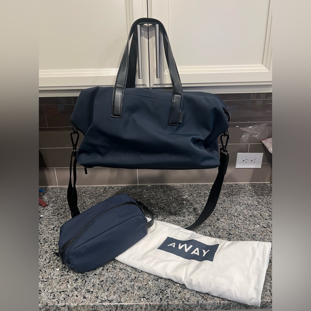 The Everywhere Bag Away Navy Gently Used - includes storage bag and toiletry bag